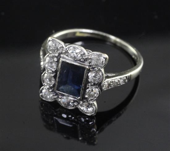 An early 20th century 18ct white gold and platinum, sapphire and diamond cluster ring, size H.
